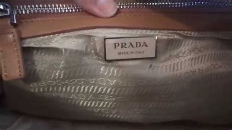 how to tell authentic prada purse|Prada purses outlet price.